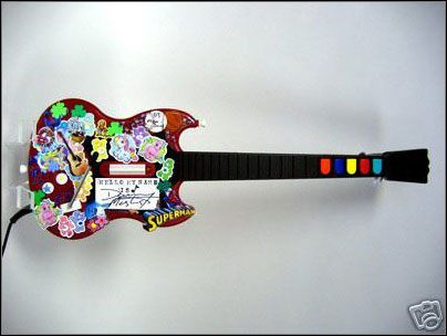 Upiększone przez znanych artystów kontrolery do Guitar Hero II przedmiotem aukcji - ilustracja #2