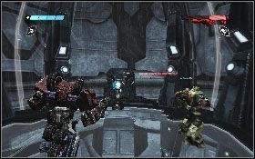 Po chwili dotrzesz do kolejnych wielkich drzwi [1], poczekaj aż się otworzą, po czym udaj się do windy [2] - - Część 6 - Obrona Iacon (1) - Opis przejścia - Transformers: Wojna o Cybertron - poradnik do gry