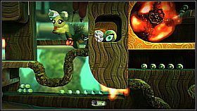 Nie spadamy od razu na poziom z płonącą kulą - musimy zrobić to odpowiednio, żeby dostać dodatkowe przedmioty - Pomoc jest cnotą | Azyl Ewy | LittleBigPlanet 2 - LittleBigPlanet 2 - poradnik do gry