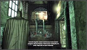Wyjdź na górę i zauważ, że za barierą ochronną znajdują się stalowe palety oraz nadająca się do zniszczenia ściana #1 - Szarada Enigmy (4) | Misje poboczne w Batman Arkham City - Batman: Arkham City - poradnik do gry