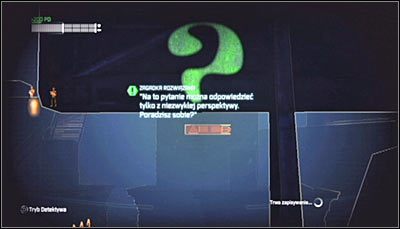 Zbadaj w trybie detektywa tylną część billboardu, a powinieneś zauważyć, iż wymalowano na niej pytajnik - Mila Rozrywki - Zagadki słowne | Zagadki w Batman Arkham City - Batman: Arkham City - poradnik do gry