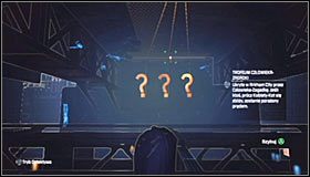 Klatka z trofeum znajduje się pod dużym mostem #1 i dobrze byłoby przedostać się na znajdujące się w tym miejscu torowisko kolejki jednoszynowej #2 - Zaułki - Trofea Batmana (24-39) | Zagadki w Batman Arkham City - Batman: Arkham City - poradnik do gry