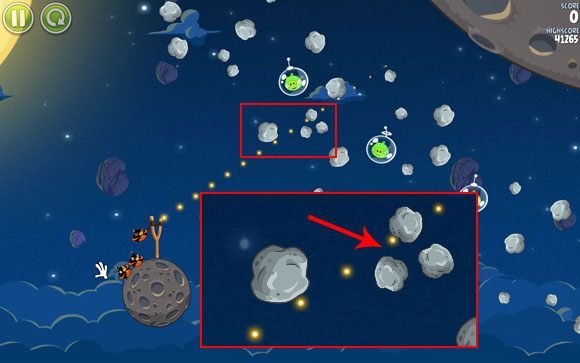 Pierwszym rozwiązaniem jest skierowania między trzy mniejsze asteroidy zaznaczone na obrazku - Level 1 - 15 | Pig Bang | Angry Birds Space - Angry Birds Space - poradnik do gry