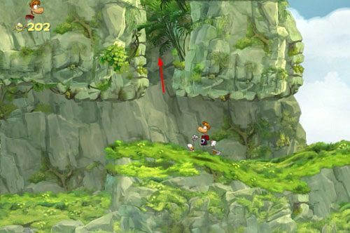 Za drzwiami z okiem korzystając z kucania dostań się do ukrytego pomieszczenia z E - Waligóra (300 L, 1:40) | Pokręcona Dżungla | Rayman Origins - Rayman Origins - poradnik do gry