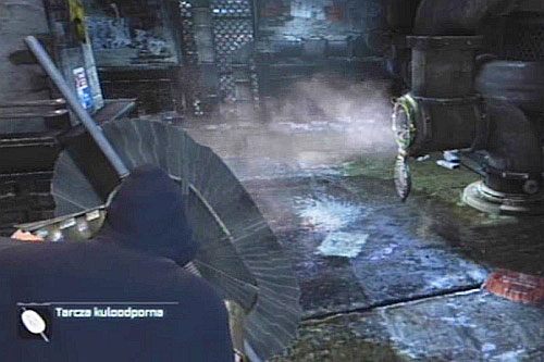 Dalej ponownie korzystając z tarczy, osłaniaj się przed parą z rury i przejdź dalej - Zbadaj sprawę zniknięcia Batmana - Opis przejścia - Batman: Arkham City - Harley Quinns Revenge - poradnik do gry