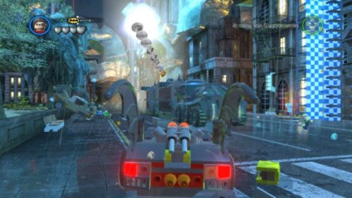 Żeby zacząć ten poziom musisz strzelić rakietą w jeżdżący po mieście ogromny pojazd Jokera (obrazek) - Chemiczny ślad | Opis przejścia LEGO Batman 2 DC Super Heroes - LEGO Batman 2: DC Super Heroes - poradnik do gry