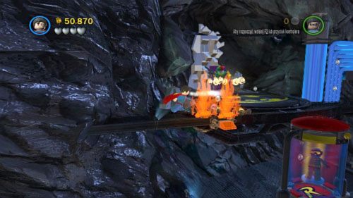 Ugaś Supermanem pożar na górnej platformie (obrazek), a Robinowi załóż kostium magnetyczny - Nieproszeni goście | Opis przejścia LEGO Batman 2 DC Super Heroes - LEGO Batman 2: DC Super Heroes - poradnik do gry