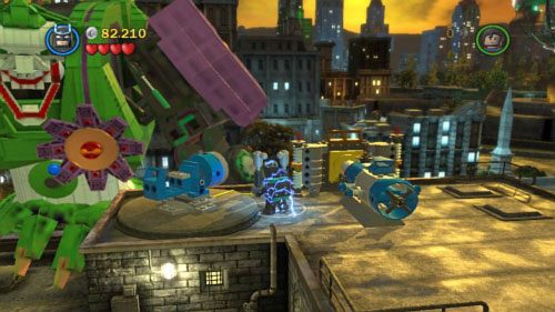 Po strąceniu śmigłowca skieruj się w lewo i zniszcz złotą płytkę laserem Supermana - Nowy prezydent | Opis przejścia LEGO Batman 2 DC Super Heroes - LEGO Batman 2: DC Super Heroes - poradnik do gry