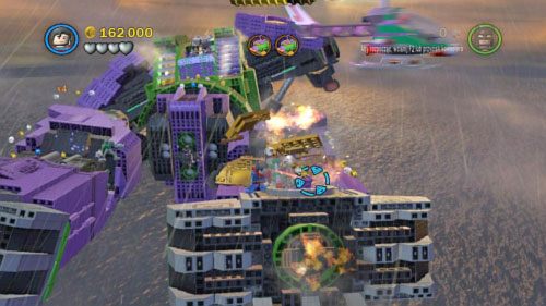 #06 - Zniszcz złotą blachę na prawej nodze robota, a z klocków zbuduj wyrzutnię rakiet - Kierunek - Ziemia | Minizestawy LEGO Batman 2 DC Super Heroes - LEGO Batman 2: DC Super Heroes - poradnik do gry