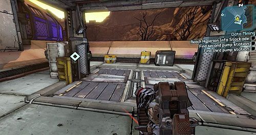 Na miejscu skorzystaj z windy pokazanej na obrazku, która zabierze Cię do podziemi - Data Mining | Zadania główne w Borderlands 2 - Borderlands 2 - poradnik do gry