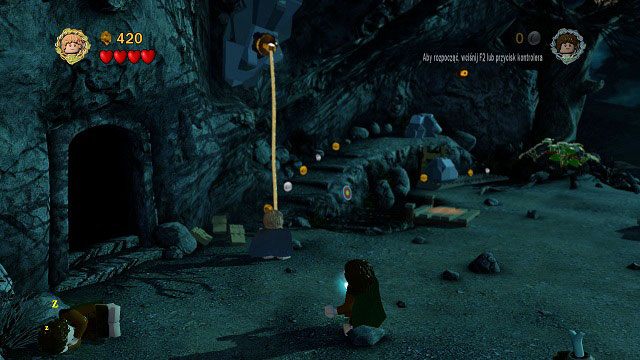 Tuż obok jaskini znajduje się hak, na który musimy zarzucić linę - Wichrowy Czub | Znajdźki | LEGO The Lord of the Rings - LEGO The Lord of the Rings: Władca Pierścieni - poradnik do gry