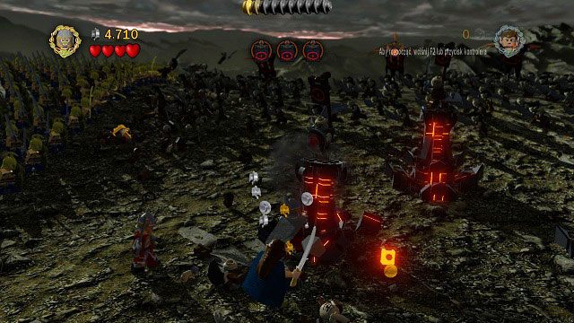 W celu zniszczenia kolumn i dopadnięcia znajdujących się na ich szczytach tarczowników musimy zmienić postać - Prolog | Opis przejścia - Akt I | LEGO The Lord of the Rings - LEGO The Lord of the Rings: Władca Pierścieni - poradnik do gry