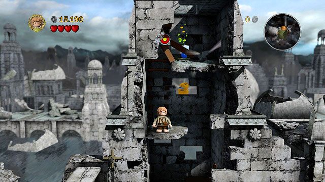 Z leżących na ziemi klocków LEGO budujemy trampolinę, dzięki której wskakujemy na pierwszą kondygnację wieży - Osgiliath | Opis przejścia - Akt II | LEGO The Lord of the Rings - LEGO The Lord of the Rings: Władca Pierścieni - poradnik do gry