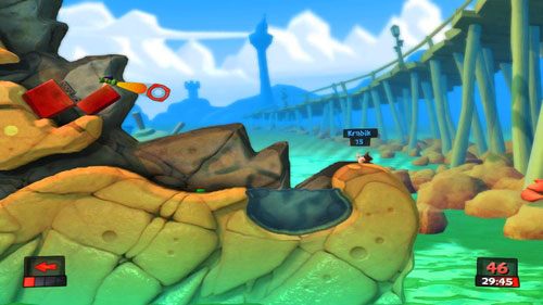 Na początku stajemy na zapalniczce i mierząc z Bazooki [ilustracja] oddajemy strzał w stronę przeciwnika nad skraju mapy (z maksymalną mocą) - Ahoj, nadchodzi ból! | Plaża (Kampania) | Worms Revolution - Worms: Revolution - poradnik do gry