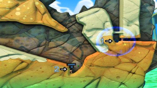 Gdy wypalimy sobie drogę do dziury pod miną stawiamy w niej trzeci Elektromagnes nastawiony na odpychanie [1], dzięki czemu kolejna Mina wyląduje koło naszego przeciwnika, tym samym zabijając go [2] - Plaża | Łamigłówki | Worms Revolution - Worms: Revolution - poradnik do gry