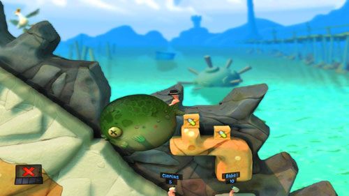 Ustawiając po raz kolejny rybę w odpowiedni sposób za pomocą UFO [ilustracja], wchodzimy na półkę skalną, gdzie znajdziemy Wodny atak oraz Mobilizator - Plaża | Łamigłówki | Worms Revolution - Worms: Revolution - poradnik do gry