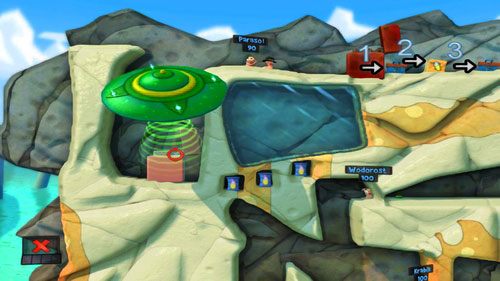 Używając zdobytego UFO, przemieszczamy zapalniczkę do wnęki [ilustracja], a następnie przy pomocy Ognistego uderzenia wrzucamy tam Parasol - Plaża | Łamigłówki | Worms Revolution - Worms: Revolution - poradnik do gry