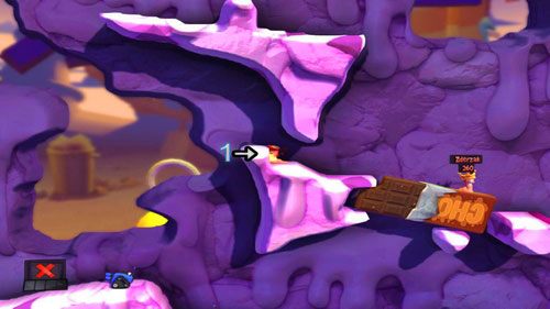 Przy pomocy Ognistego uderzenia niszczymy fragment krawędzi [1], dzięki czemu będziemy w stanie wybić robala w powietrze - Wszystkie atrakcje wesołego miasteczka! | Łamigłówki | Worms Revolution - Worms: Revolution - poradnik do gry