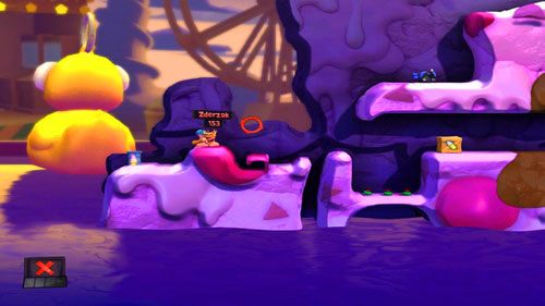 Dzięki pomocy Działka strażniczego, nasz kamrat wyląduje na wysepce [ilustracja] - Wszystkie atrakcje wesołego miasteczka! | Łamigłówki | Worms Revolution - Worms: Revolution - poradnik do gry