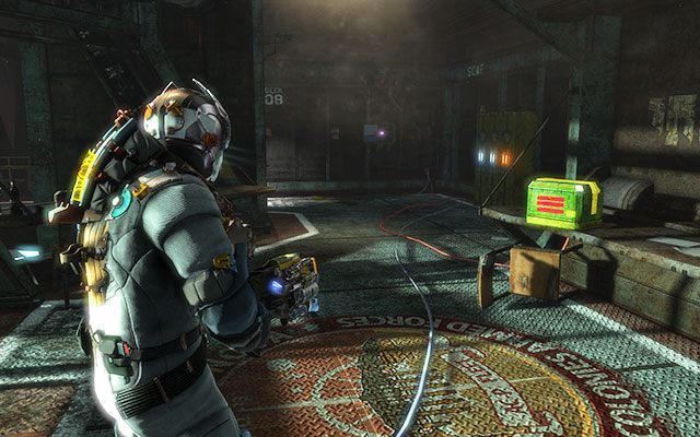 Wewnątrz pomieszczenia sterowani pompą paliwową, w głębi zaraz przy szafkach - Rozdział 6 | Sekrety | Dead Space 3 - Dead Space 3 - poradnik do gry