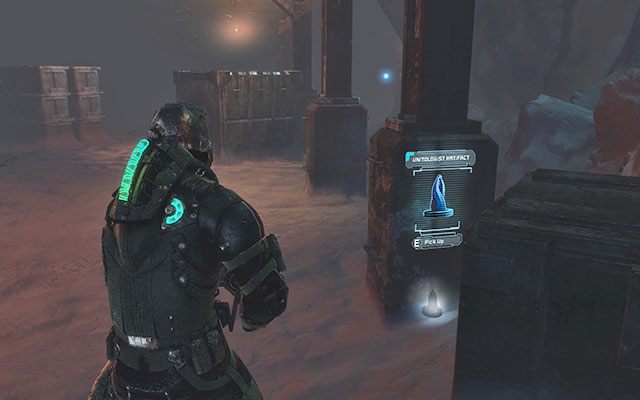 Przy jednym z filarów między skrzyniami, tuż przed windą towarową - Rozdział 14 (2) | Sekrety | Dead Space 3 - Dead Space 3 - poradnik do gry