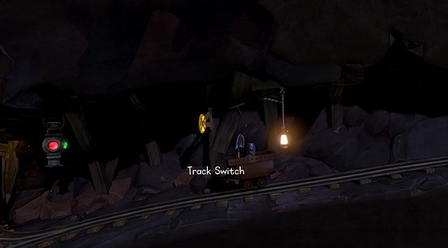 Siedząc w wagoniku w trakcie jazdy za pomocą łopatki przełącz zwrotnicę (Track Switch) - Kopalnia | Jaskinia (sekcje ogólnodostępne) w The Cave - The Cave - poradnik do gry