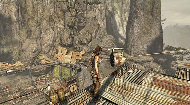 Użyj czekana, by zniszczyć alarm (nagroda: 10 punktów doświadczenia) - Wileka cisza | Sekrety - Shantytown (Miasto ubogich) - Tomb Raider - poradnik do gry