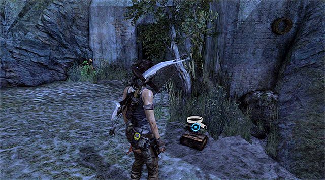 Skrzynka z monetą leży na ziemi po prawej stronie (nagroda: 500 punktów doświadczenia) - Relikty | Sekrety - Cliffside Bunker | Sekrety Tomb Raider - Tomb Raider - poradnik do gry