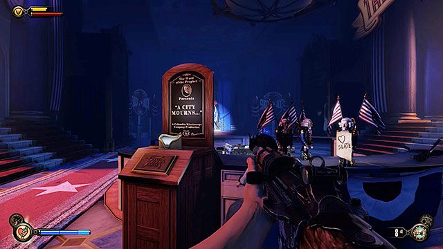 Na środku pomieszczenia znajdziesz Punkt Widokowy #21 - Znajdź Slatea za pomnikiem Pierwszej Damy | Rozdział 10 - W Sali Bohaterów - BioShock: Infinite - poradnik do gry