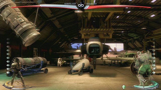 Na lewym końcu areny znajduje się zawieszony pod sufitem silnik odrzutowy - Injustice: Ferris Aircraft - arena - Injustice Gods Among Us - poradnik do gry