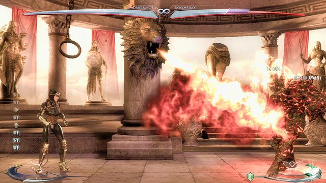 Po lewej i po prawej stronie środka areny znajdują się lwie głowy na kolumnach i uchwyty na łańcuchach - Injustice: Themyscira - arena - Injustice Gods Among Us - poradnik do gry