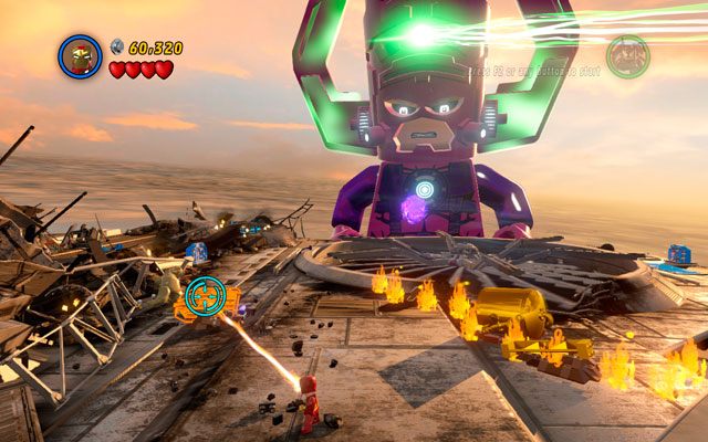 Po drugiej stronie pojazdu użyj laserowego działa Iron Mana, aby przepalić złoty klocek po lewej - Galactus | Bossowie w LEGO Marvel Super Heroes - LEGO Marvel Super Heroes - poradnik do gry