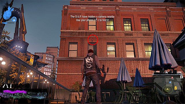 2) Ukryta kamera (Hidden Camera) - Poszukiwana kamera znajduje się w pokazanym na powyższym screenie miejscu - Downtown - Trudniejsze aktywności - Miasto - inFamous: Second Son - poradnik, opis przejścia, miasto