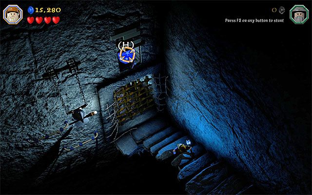 Musisz trafić pociskiem w niebieski obiekt nad bramą - Etap 13 (Looking for Proof) - Grobowiec czarnoksiężnika z Angmaru | Opis przejścia - LEGO The Hobbit - poradnik do gry