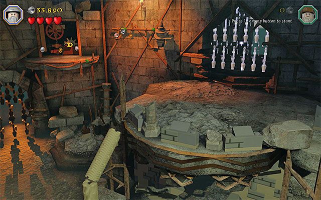 Do półki z drugim pokrętłem dotrzesz chwytając się bocznej krawędzi - Etap 14 (The Necromancer) - Wnętrze twierdzy | Opis przejścia LEGO The Hobbit - LEGO The Hobbit - poradnik do gry