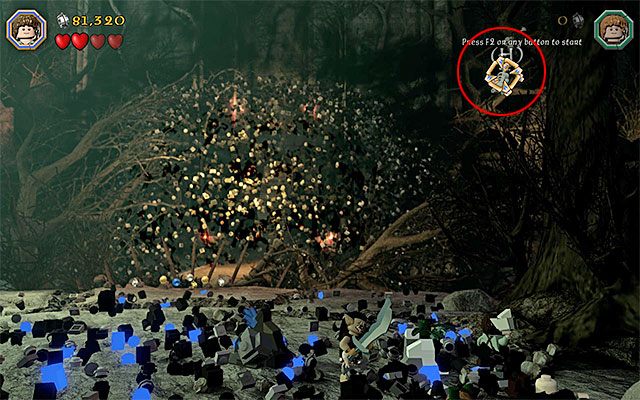 Odczekaj aż Sauron zakończy jeden ze swoich ataków, szybko podnieś wykopany z ziemi klocek i rzuć nim w pokazany na powyższym obrazku szkielet, który znajduje się po prawej stronie - Etap 14 (The Necromancer) | Główne etapy - Sekrety w LEGO The Hobbit - LEGO The Hobbit - poradnik do gry