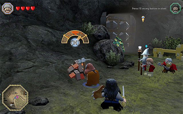 Niszczenie skupisk klocków kilofem pozwoli ci pozyskać potrzebne sztabki - Śródziemie - Dotarcie do jaskini trolli | Opis przejścia LEGO The Hobbit - LEGO The Hobbit - poradnik do gry