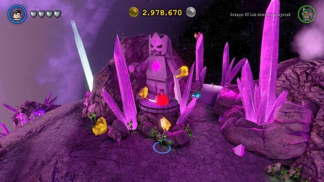 Zniszcz złoty pierścień, który trzyma posąg a odblokujesz pierwszy złoty klocek - Złote Klocki | Zamaron - sekrety w Lego Batman 3 Poza Gotham - LEGO Batman 3: Poza Gotham - poradnik do gry