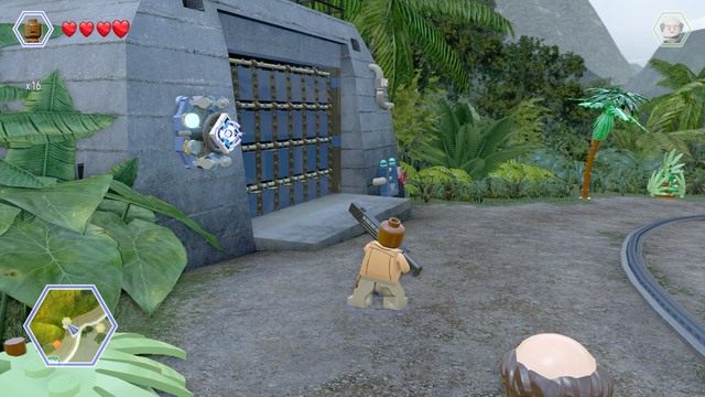 Strzel w niebieską tarczę postacią Barryego i wejdź do zaciemnionego garażu jako Timmy - Terytorium mięsożerców | Jurassic Park - sekrety - LEGO Jurassic World - poradnik gry