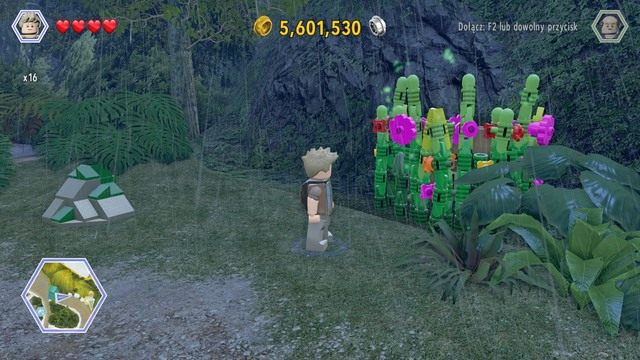 Po przejściu na drogę udaj się w stronę widocznych na obrazku roślin i przetnij je postacią Granta - Terytorium mięsożerców | Jurassic Park - sekrety - LEGO Jurassic World - poradnik gry
