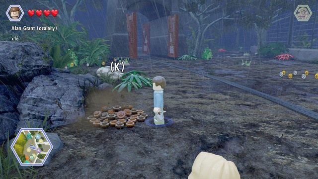 Podejdź do widocznej na obrazku kupki ziemi jako Grant i wykop z nich klocki - Zagroda Tyranozaura | Jurassic Park - sekrety - LEGO Jurassic World - poradnik gry