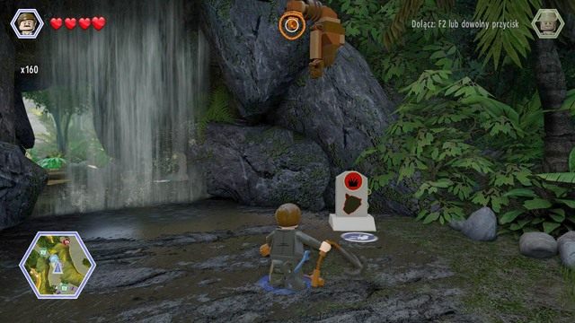 Podejdź do wodospadu jako Paul i użyj liny na widocznym na obrazku zaczepie - Wysoka trawa | Jurassic Park The Lost World - sekrety - LEGO Jurassic World - poradnik gry
