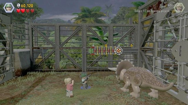 Po otwarciu bramy, podejdź jako pracownik parku i strzel z broni w widoczną na obrazku tarczę - Witamy w parku | Jurasic Park - opis przejścia - LEGO Jurassic World - poradnik gry