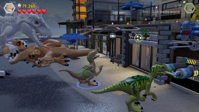 Jako velociraptor podejdź do prawego drążka i pociągnij by odblokować dostęp do drugiego po czym zmień postać na drugiego velociraptora i wskocz na górę - Wielkie starcie | Jurassic World - opis przejścia - LEGO Jurassic World - poradnik gry