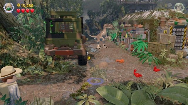 Po przedostaniu się na drugą stronę skorzystaj z kamuflażu Erica by przedostać się obok velociraptora - Eric Kirby | Jurassic Park III - opis przejścia - LEGO Jurassic World - poradnik gry