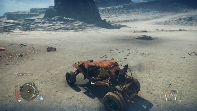 Pies zwraca swoją głowe w kierunku pól minowych, a na polach - w stronę pojedynczych min. - Pola minowe w Mad Max | Aktywności - Mad Max - poradnik do gry