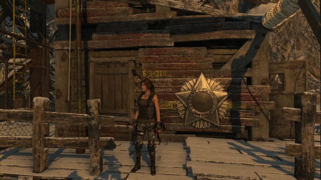 Na drewnianej ścianie Sklepu z zaopatrzeniem, niedaleko ogniska w obozie Wieża komunikacyjna - Freski | Kompleks radziecki | Skarby i sekrety w Rise of the Tomb Raider - Rise of the Tomb Raider - poradnik do gry