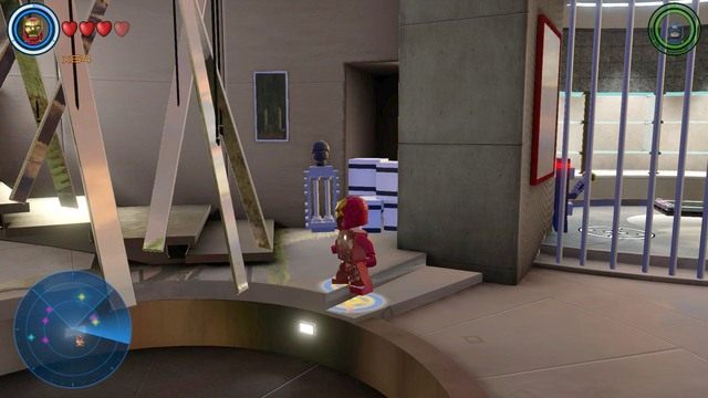 Po przeciwnej stronie, w której znajduje się Justin Hammer znajdziesz okratowane pomieszczenie - Postacie | Malibu - sekrety | LEGO Marvels Avengers - LEGO Marvels Avengers - poradnik do gry