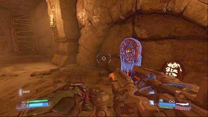 Przełącznik otworzy drzwi na dole, gdzie czeka na ciebie kolejna czerwona czaszka do wciśnięcia oraz zastępy bestii - Nekropolia | Opis przejścia | Doom - Doom - poradnik do gry