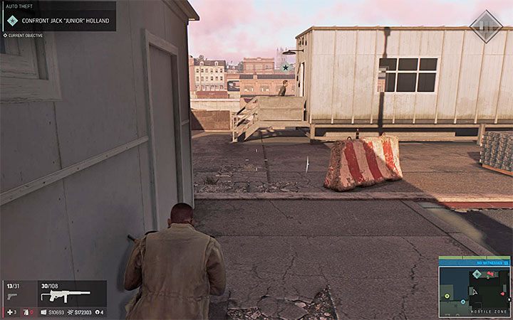 Po wkroczeniu na wrogi teren przejdź najpierw przez duży budynek, w którym naprawiane są auta - Biznes kradzieży samochodów | Misje fabularne w Mafia III - Mafia III - poradnik do gry